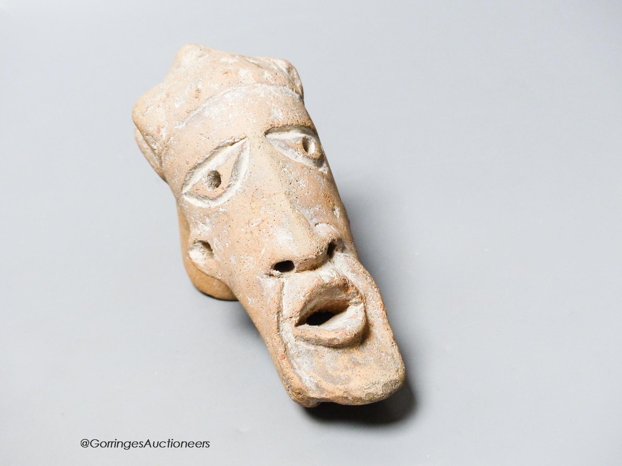 An African Tribal terracotta mask, length 16cm